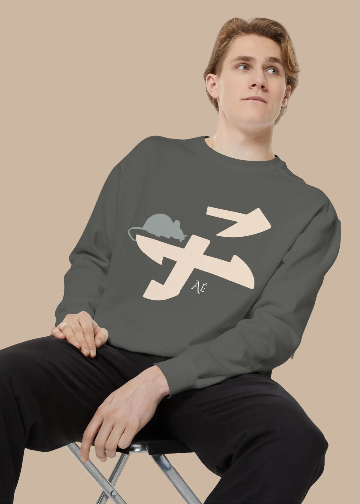 Person wearing a grey sweatshirt with Japanese zodiac animal rat.